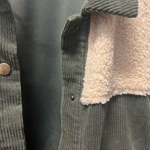 Corduroy and wool accent autumn jacket with brass buttons.